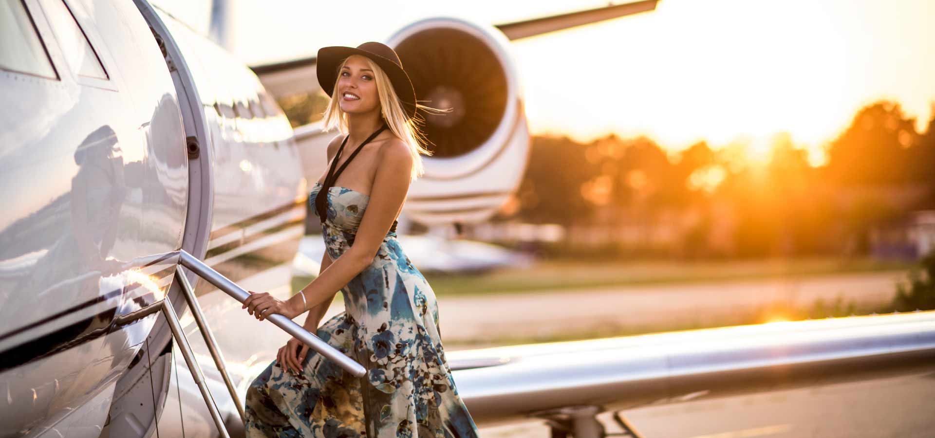 Woman walking up stairs on a private jet charter