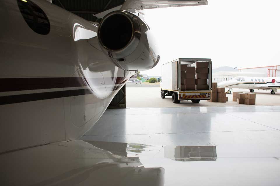 Critical freight and cargo being loaded onto a business jet