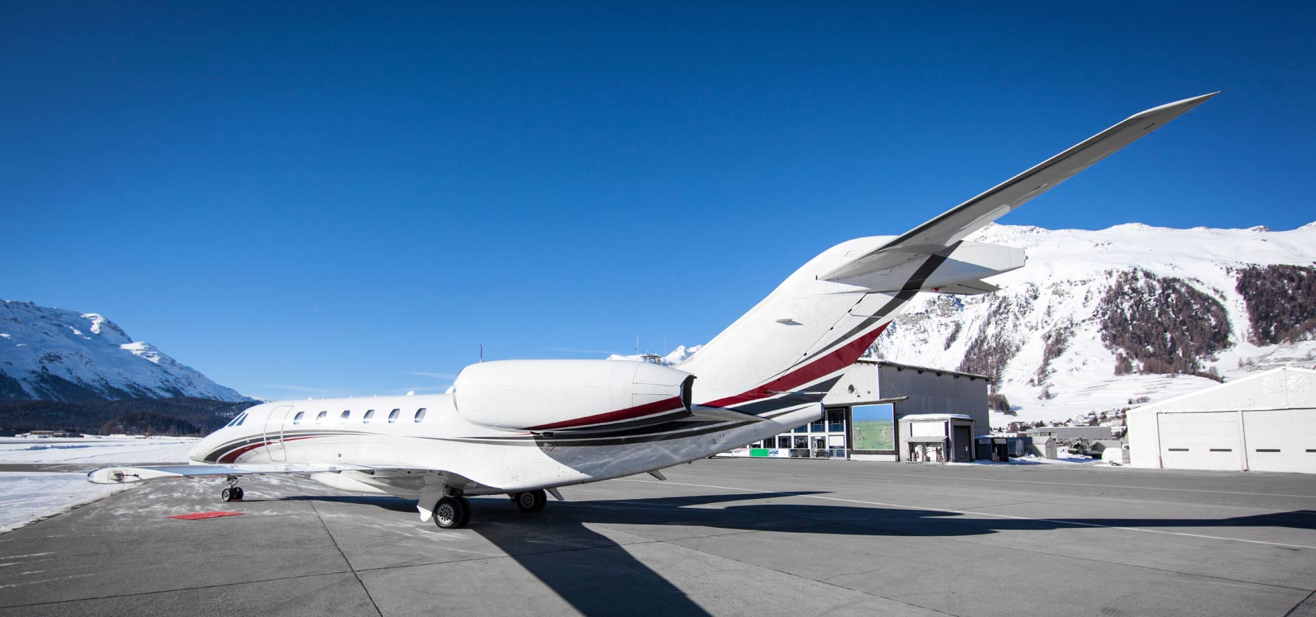 Aircraft parked in mountainous airport