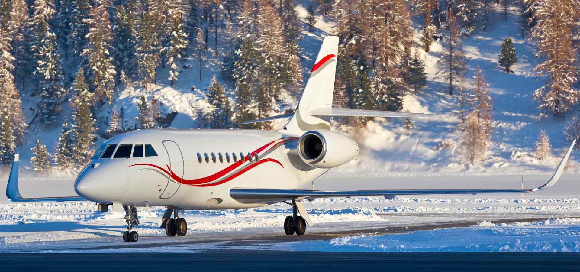 Aircraft taking off from runway in the mountains