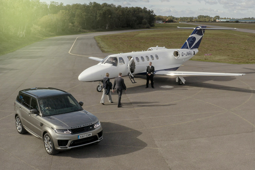 Customer walking up steps of business jet aircraft