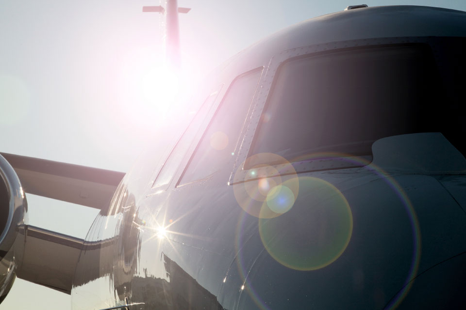 Sunburst image of a private jet