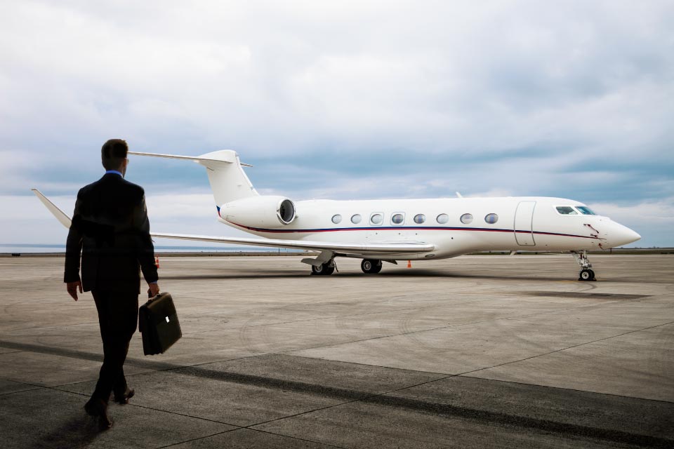 Owner walking towards his private jet
